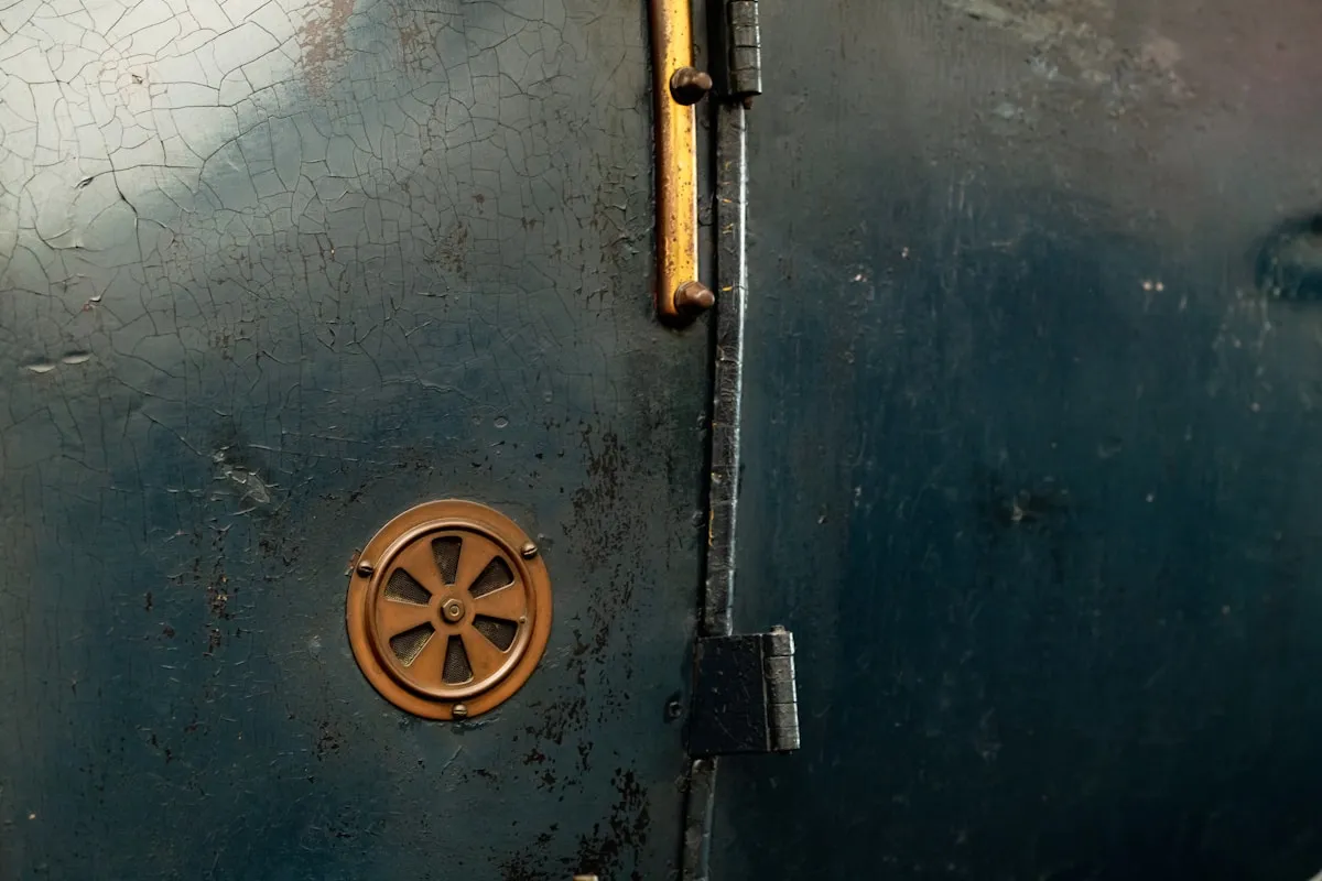 Close-up of a heavy-duty industrial door mechanism, illustrating the robust construction that separates genuine security from retail-grade containers