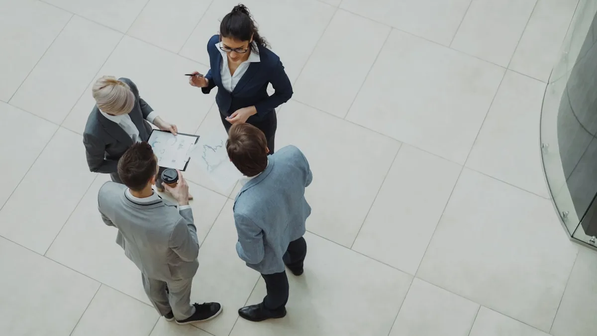 Four business professionals collaborating in a modern office, representing the estate planning professionals who help protect generational wealth
