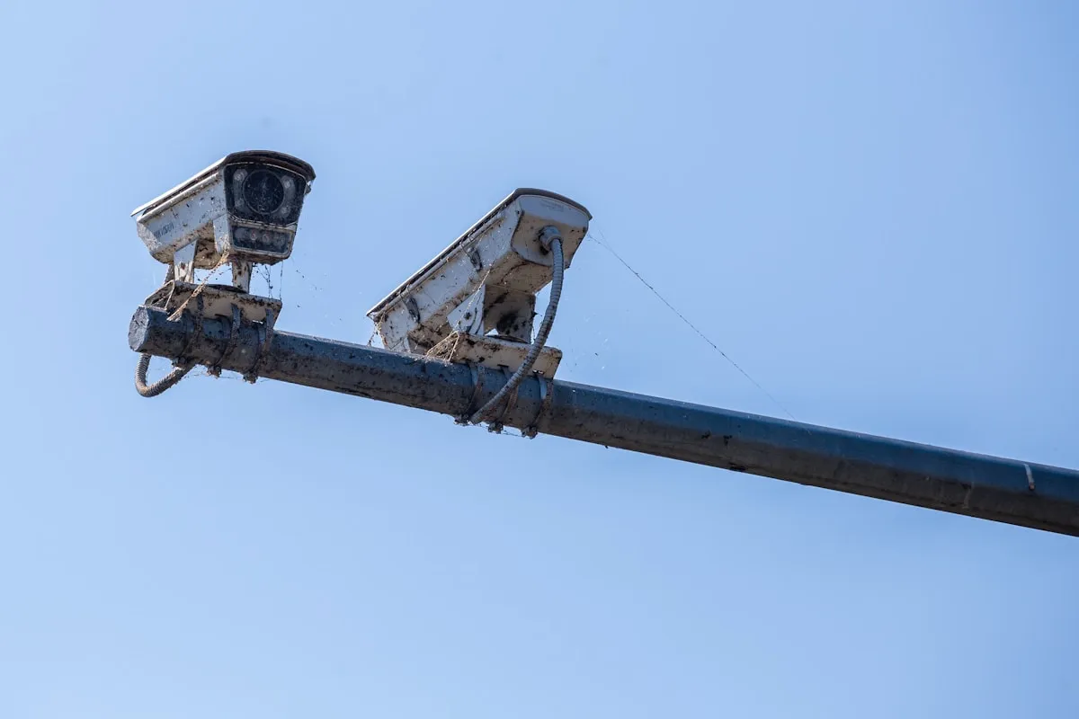 Two security cameras mounted on a pole, redundant surveillance coverage ensures no blind spots in your protection strategy
