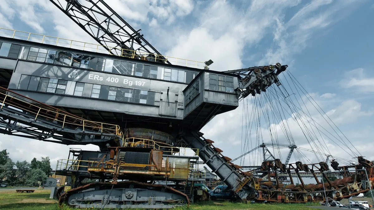 A giant excavator against a cloudy sky, demonstrating the industrial scale required to process the thousands of tonnes of rock needed to produce a single ounce of gold