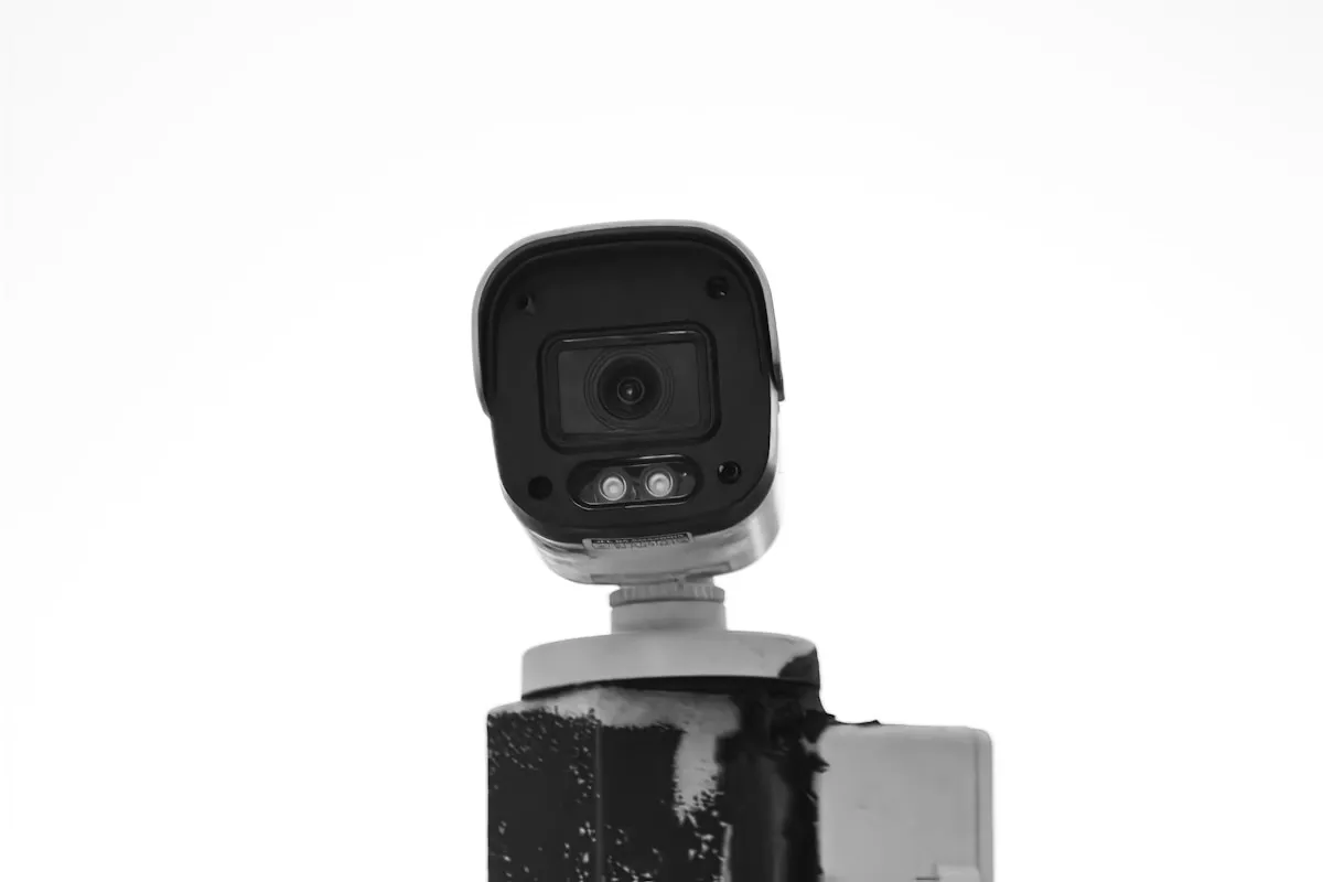 A security camera mounted on a post, representing the layered surveillance systems that protect precious metals holdings
